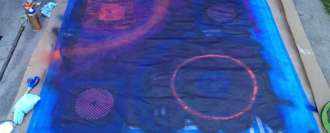 Last layer of paint: Circles of all sizes are painted using blue, red, purple, and black.